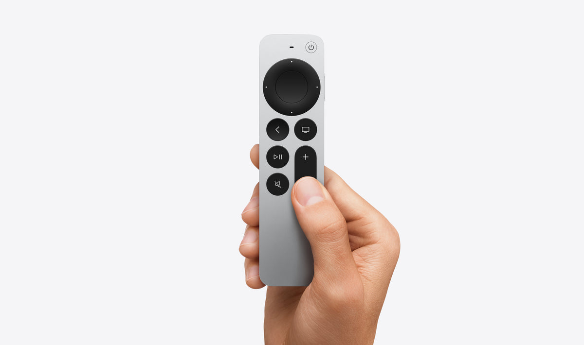 Siri Remote held in hand